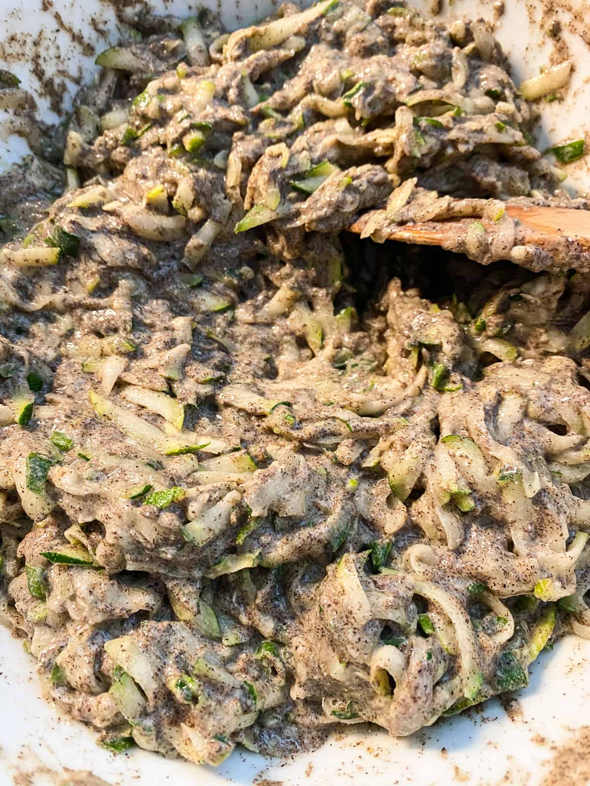 Fritter batter, after resting for 10 minutes to allow the zucchini to release its liquid.