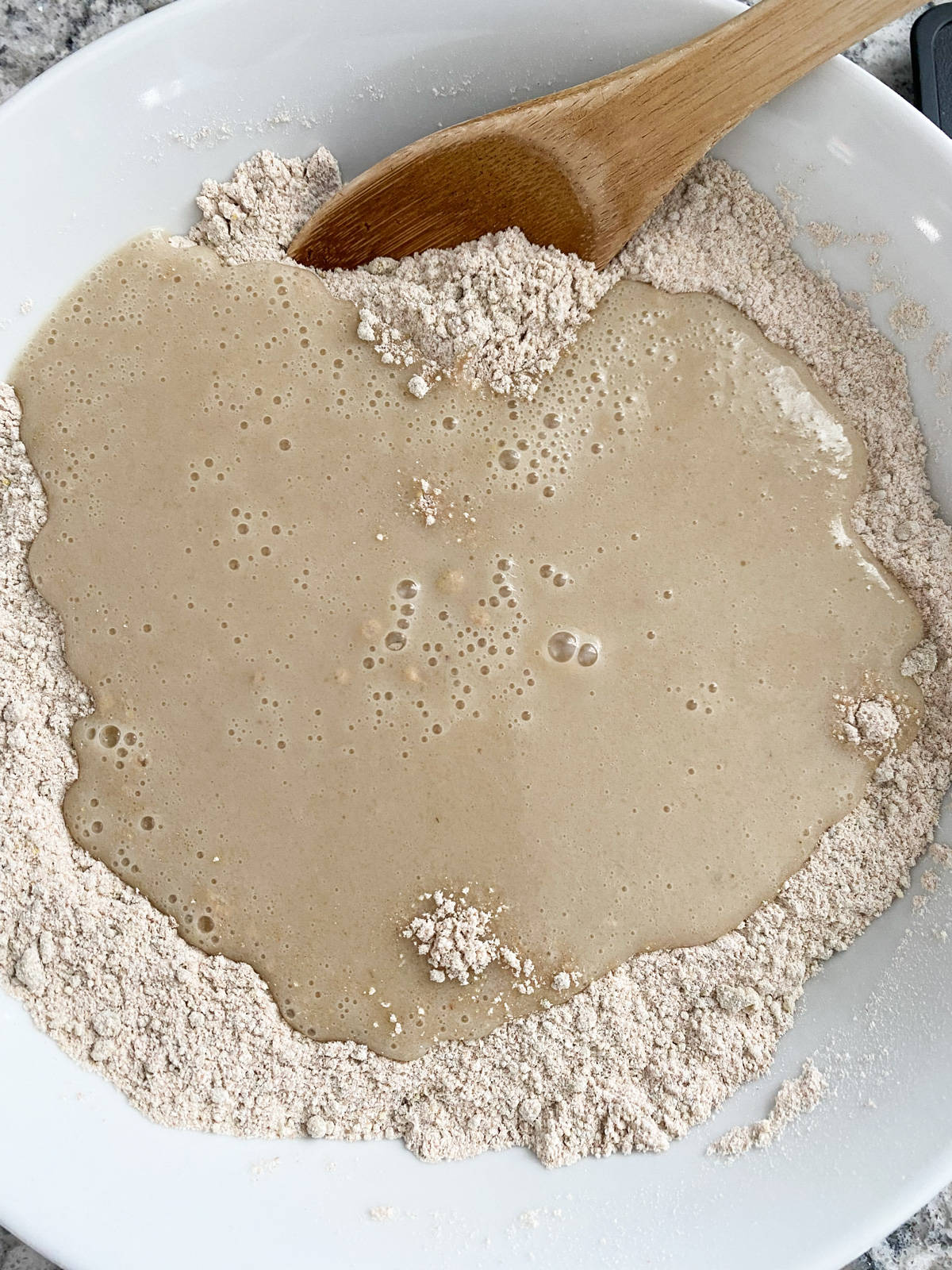 Wet ingredients poured into dry ingredients, just before mixing.
