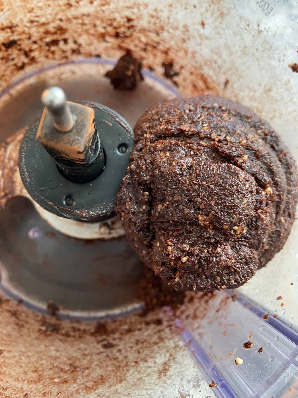 A ball of truffle dough formed in the food processor.