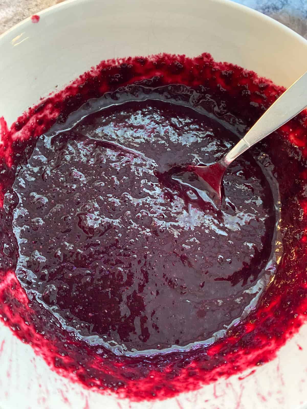 Chia seeds stirred into blueberry puree.