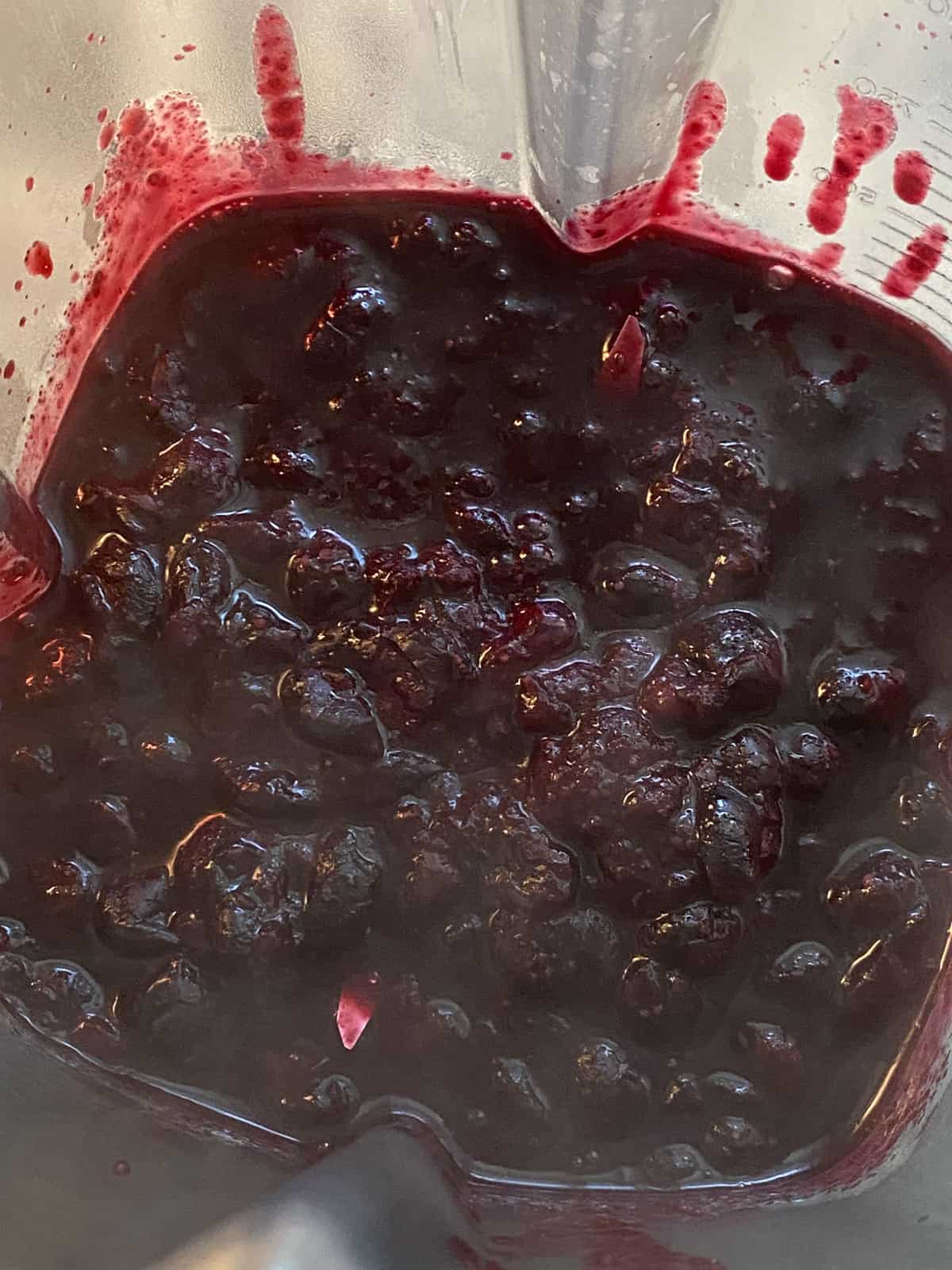 Cooked blueberries poured into blender.