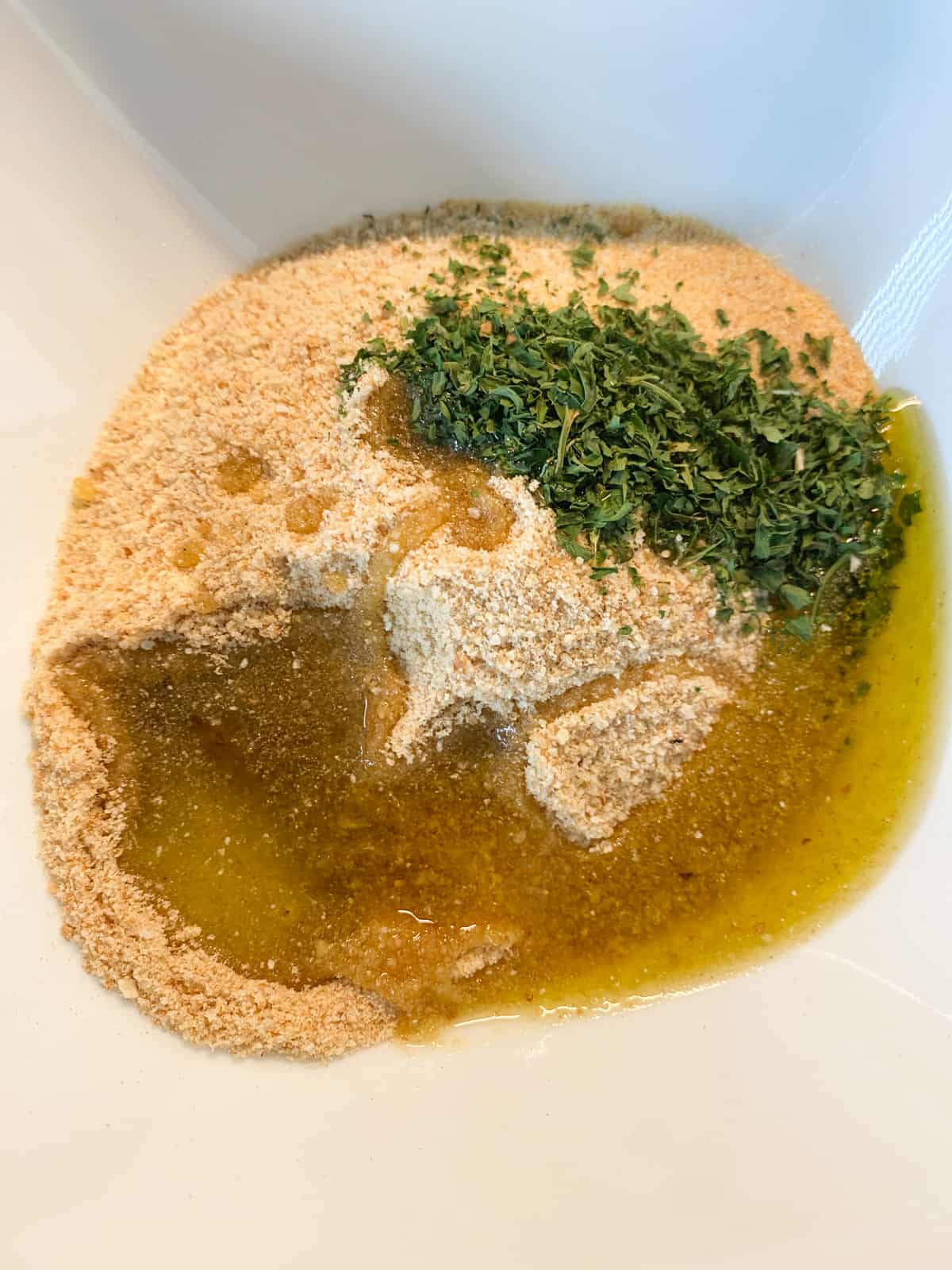 Small bowl with the ingredients for the herb topping.