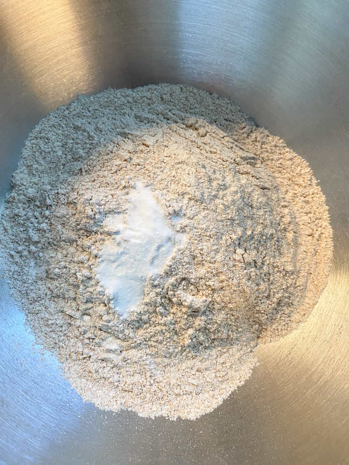 Dry ingredients for drop biscuits in a mixing bowl.