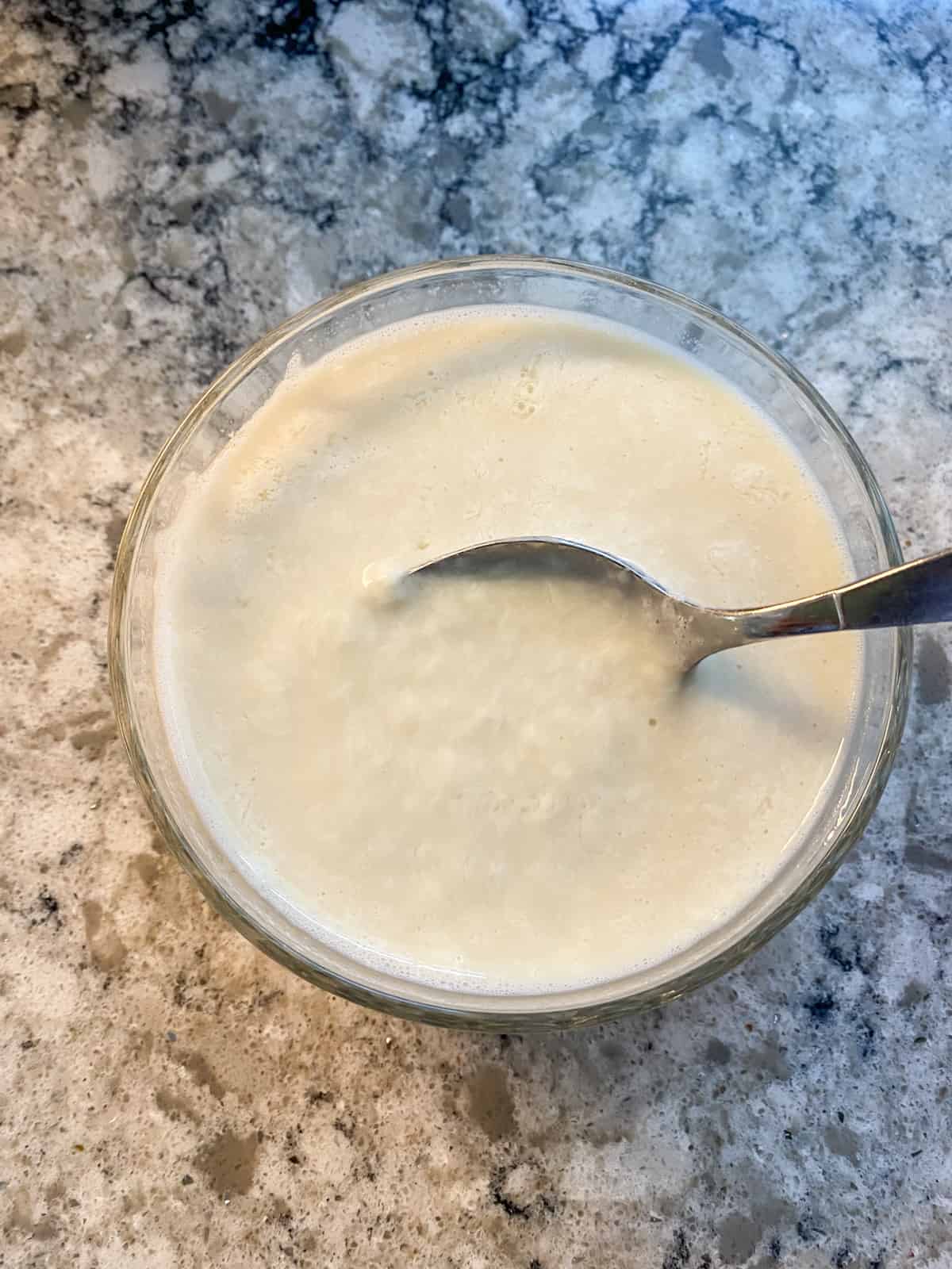 Lemon juice mixed into soy milk, and starting to curdle.