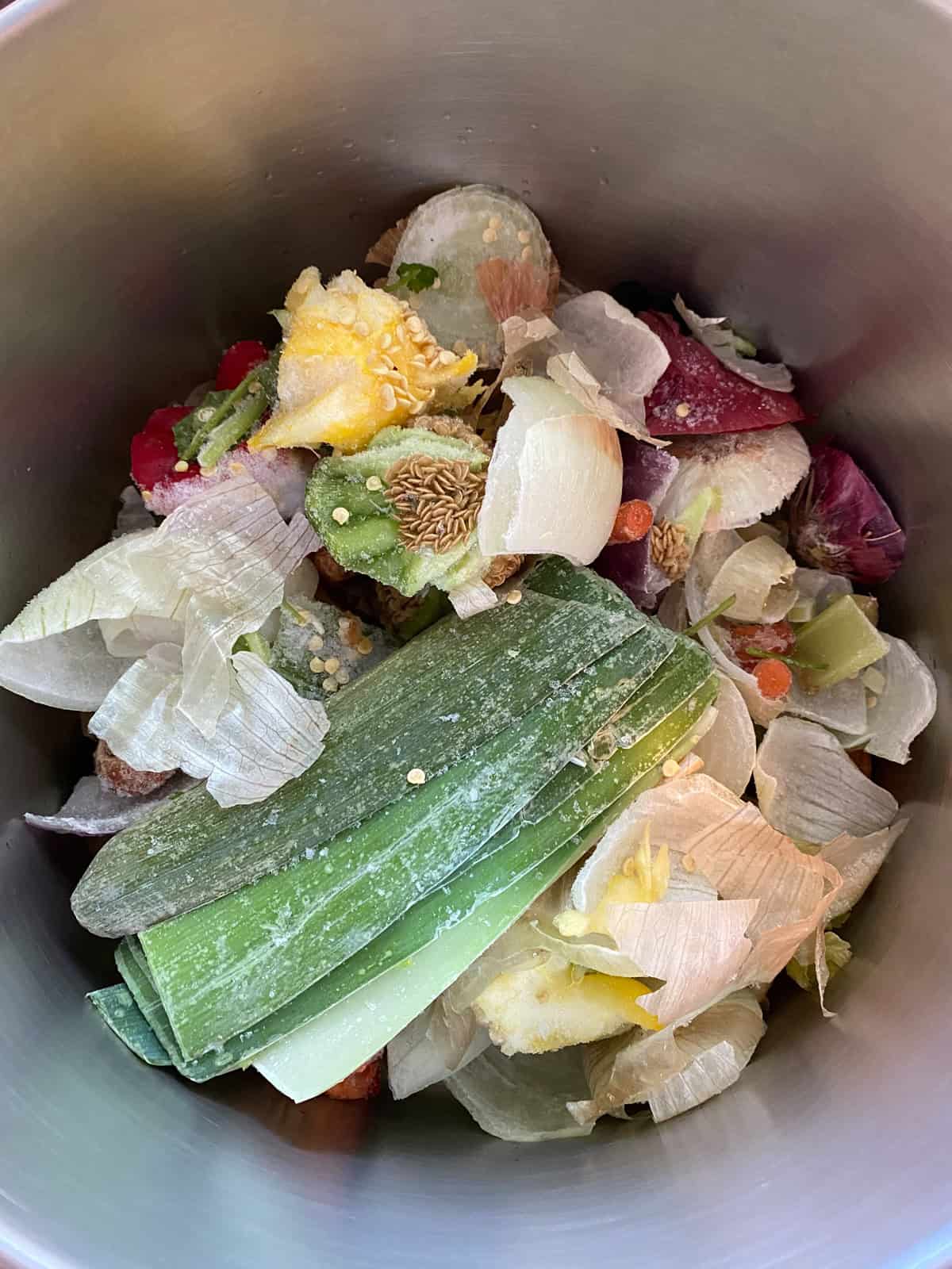 Frozen vegetable scraps in a large stock pot.