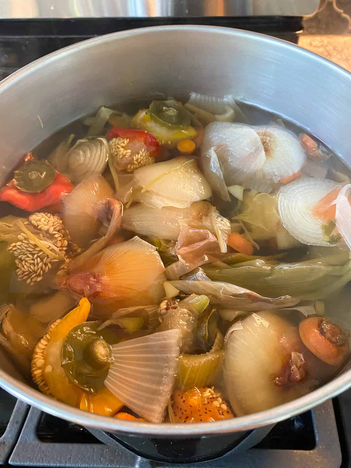 Vegetable stock ingredients, simmered for an hour.