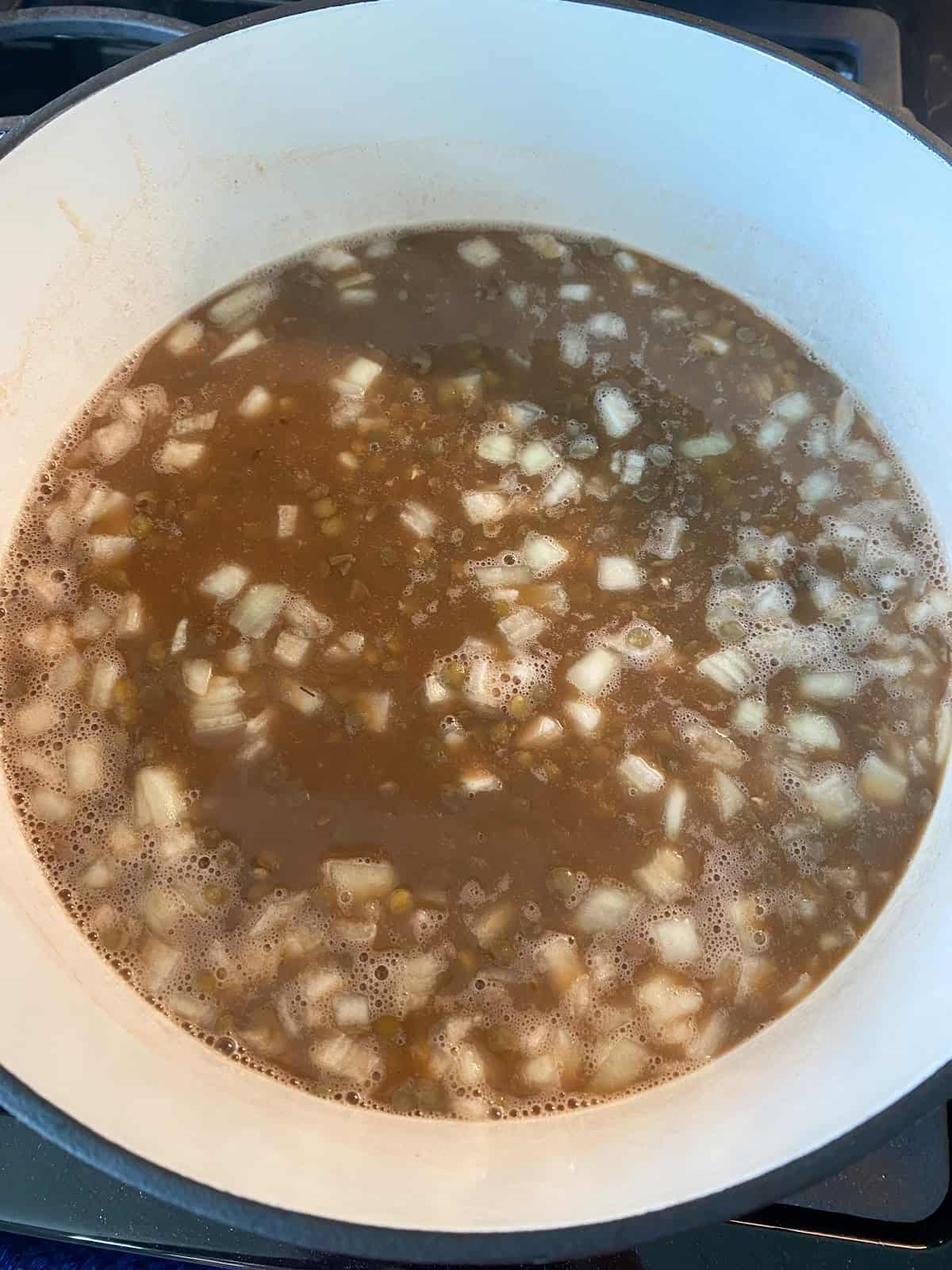 All baked bean ingredients added to the pot, and stirred together, right before baking.