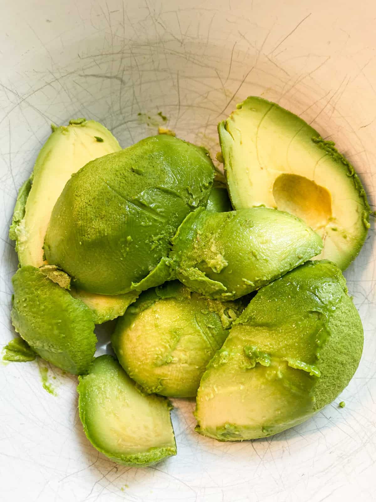 Avocado flesh in a bowl.