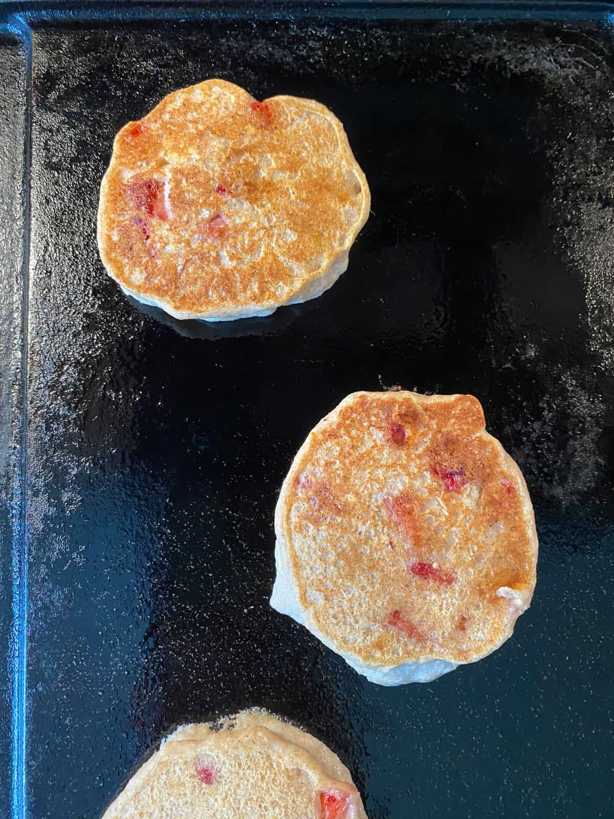 Pancaked flipped on a griddle.