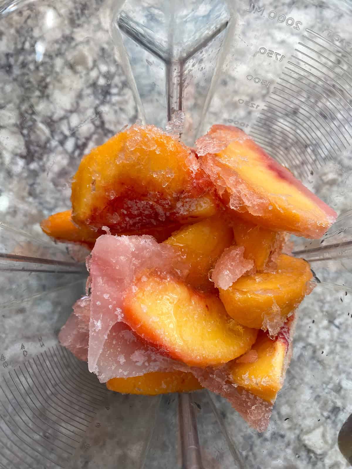 Frozen peaches in a blender.