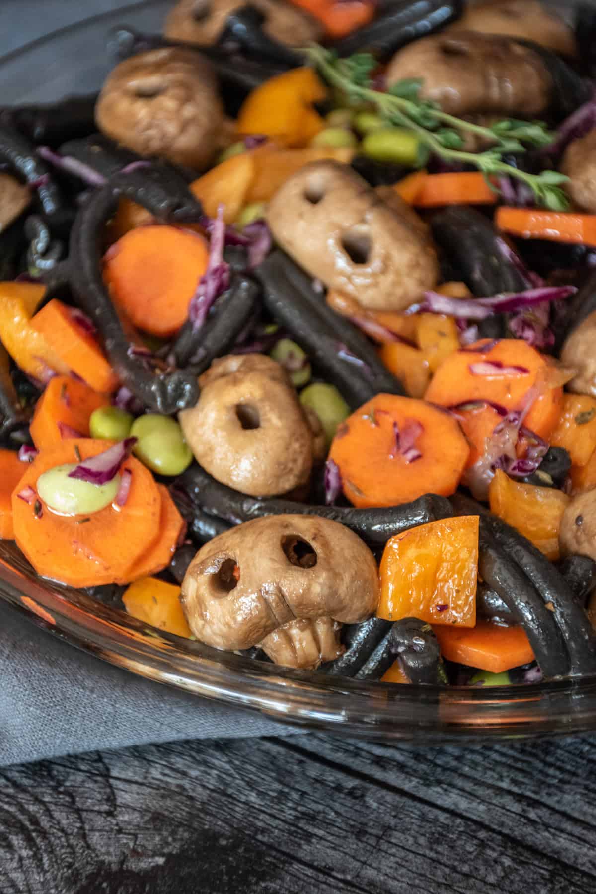Close up of Halloween pasta salad with mushroom skulls.