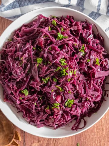 Overhead image of a bowl of cooked red cabbage.