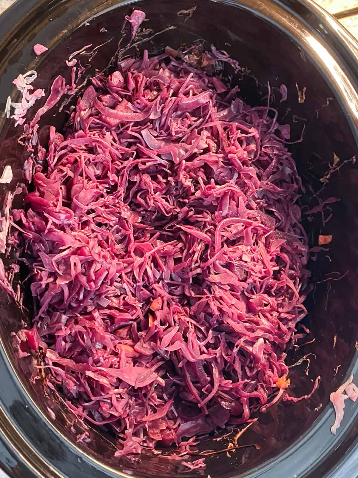 Cooked red cabbage in a slow cooker.