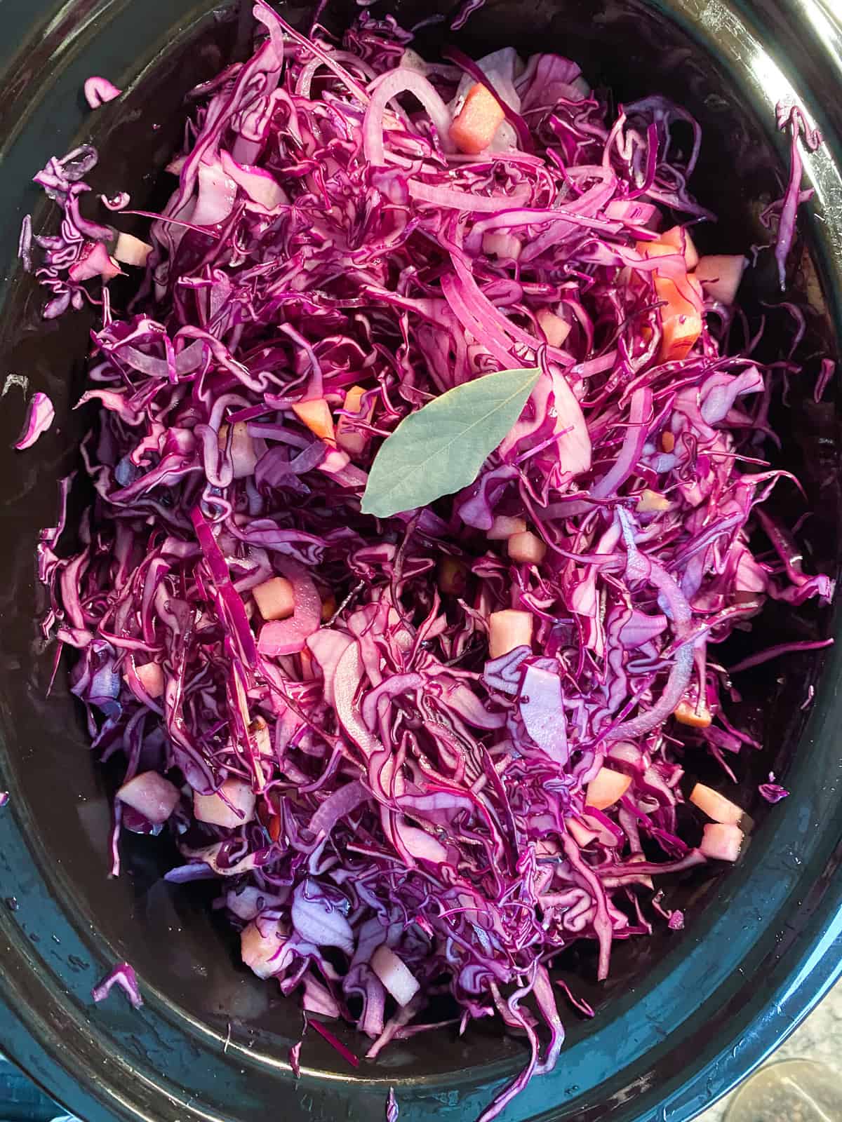 All the ingredients mixed together in the slow cooker crock.