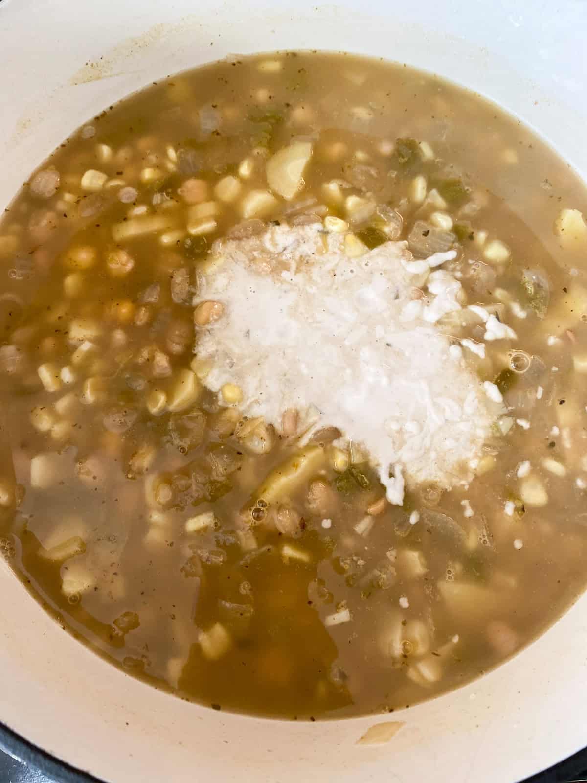 Cashew cream poured into the chili.
