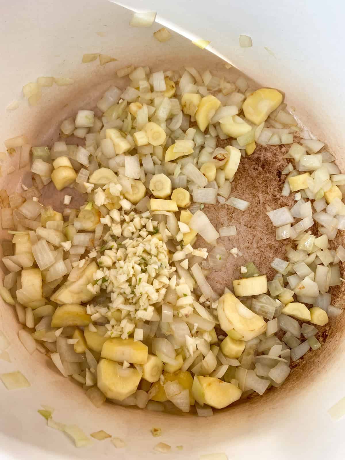 Minced garlic added to the sauteed veggies.
