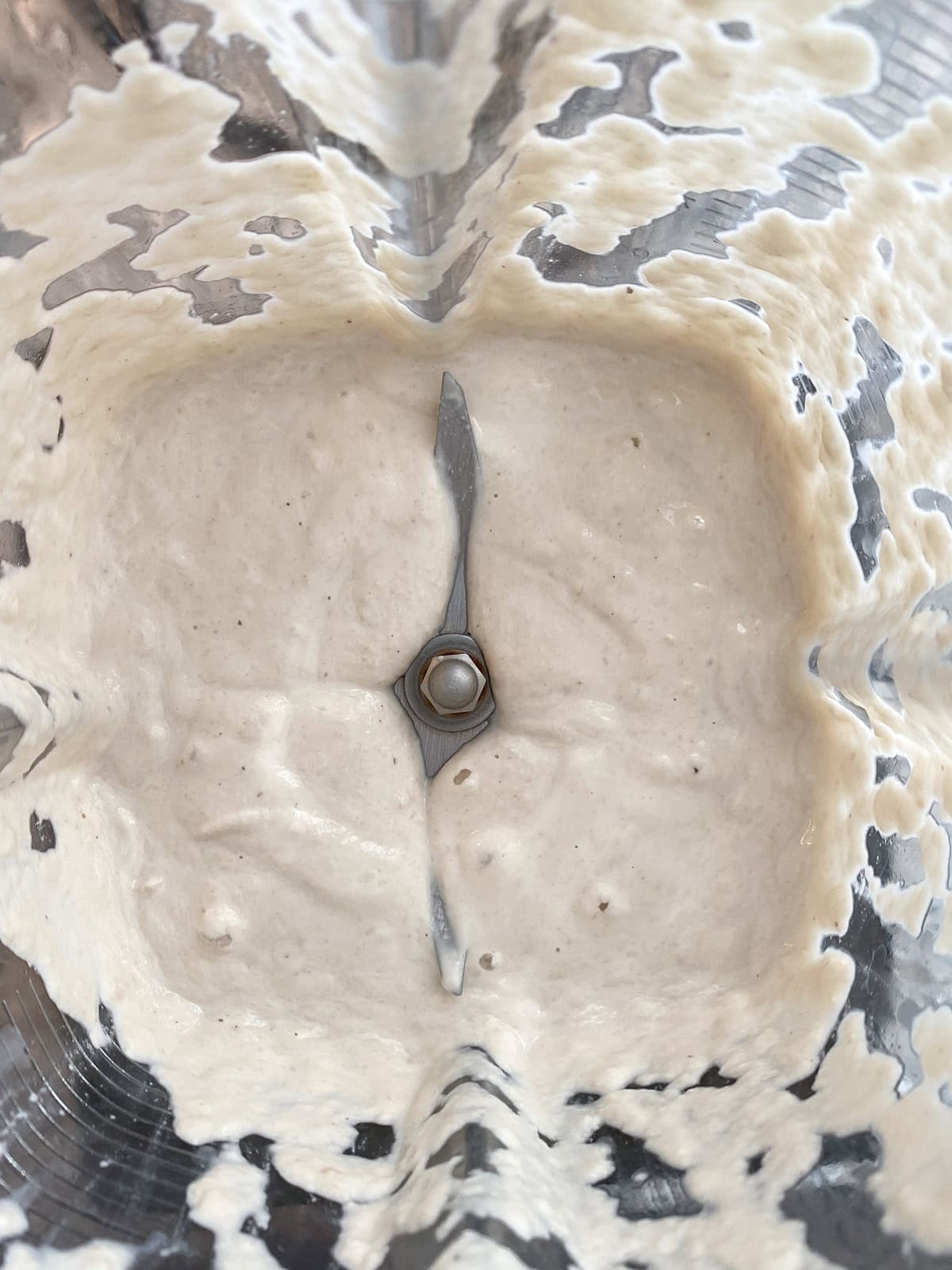 Cashews and water blended into a cream in a blender.