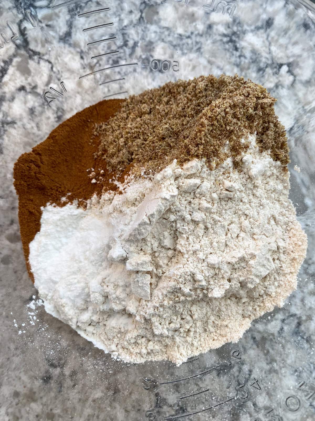 Dry muffin ingredients in a bowl.