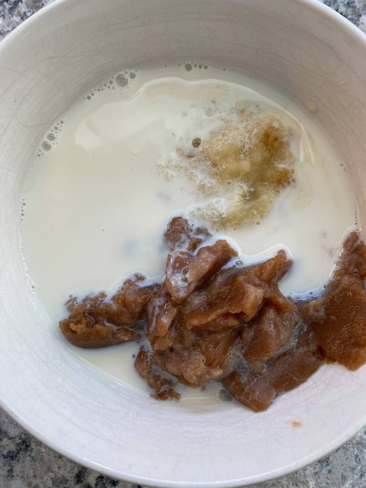 Wet ingredients for muffins in a bowl.