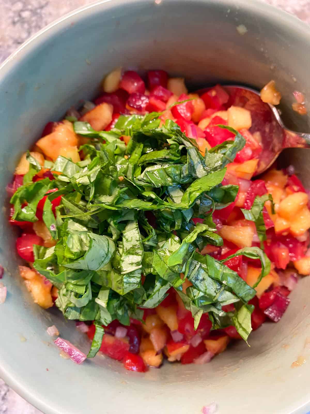 Chiffonade basil added to the peach relish.