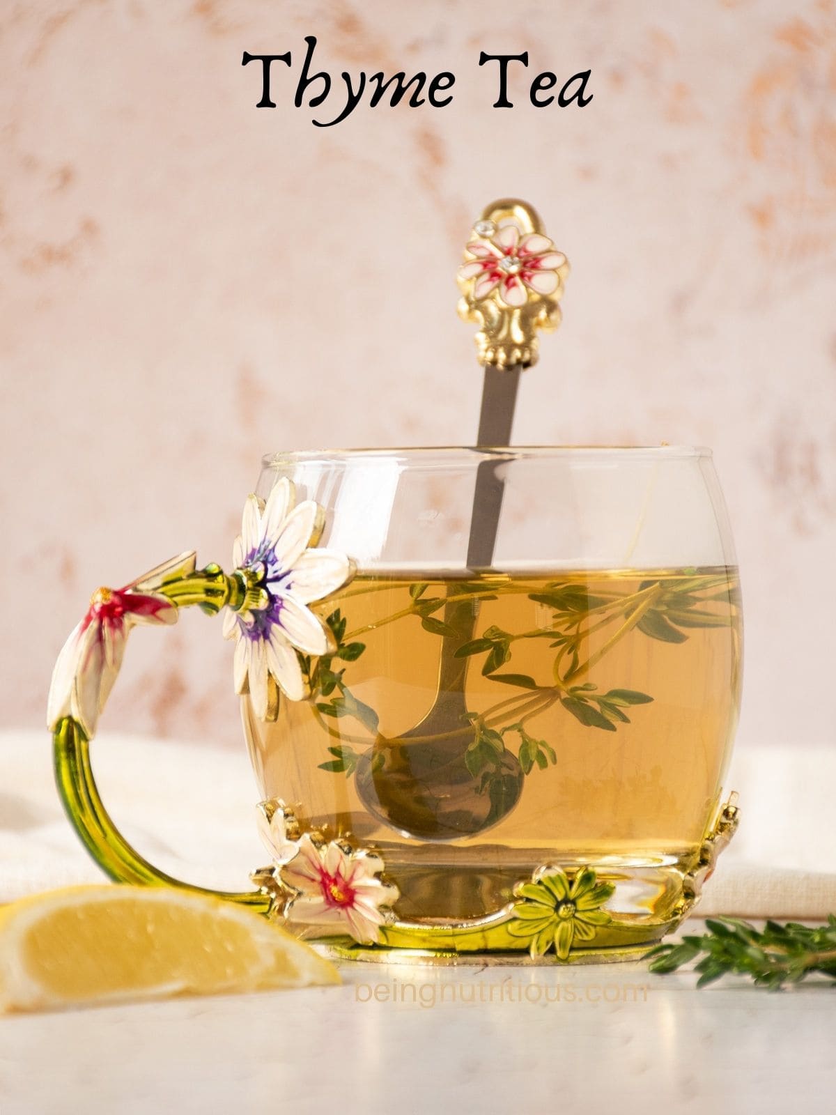 Tea in a glass mug, with thyme sprigs and a spoon in it. Text overlay: Thyme Tea.
