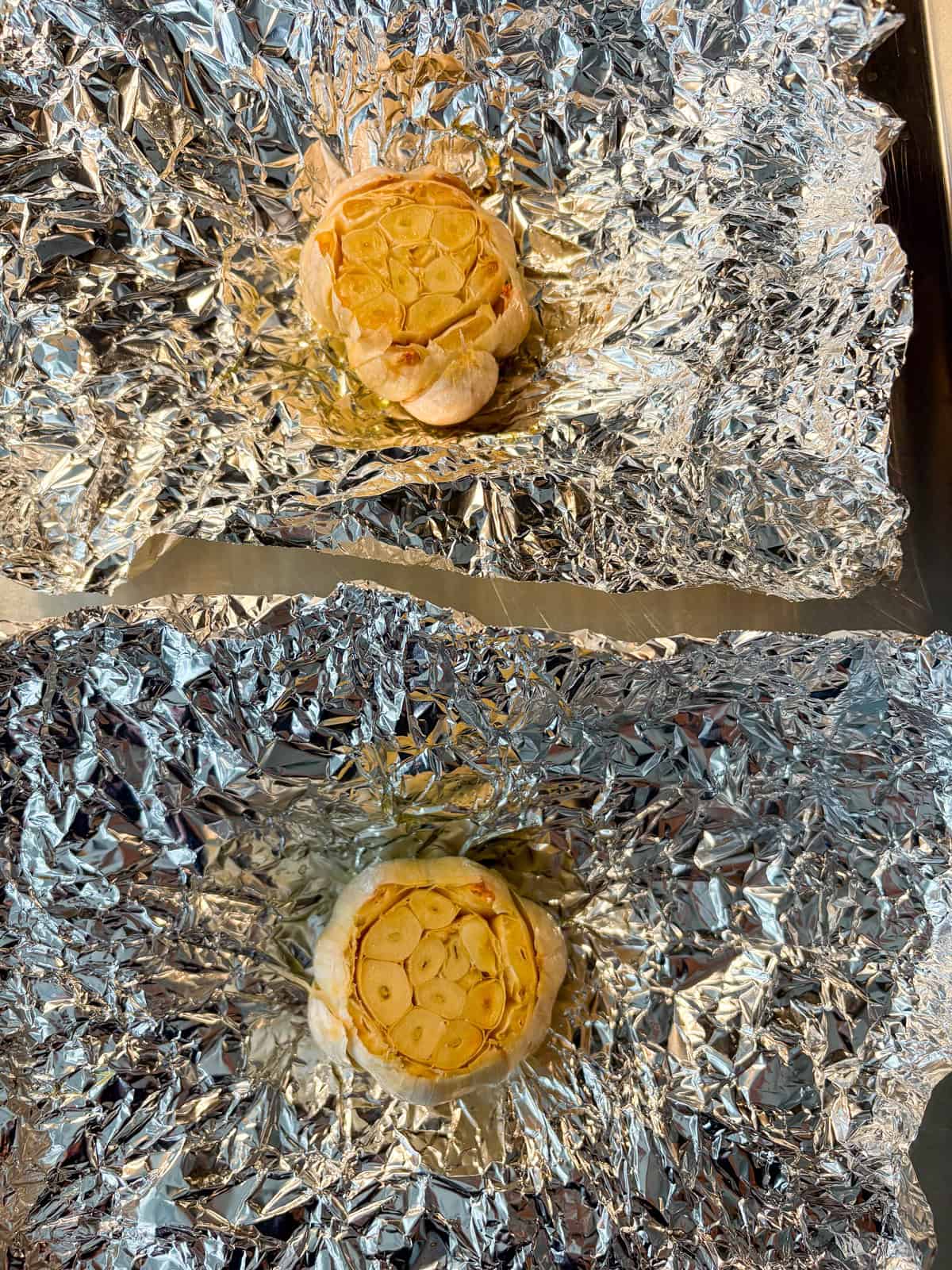Roasted garlic, unwrapped on foil.