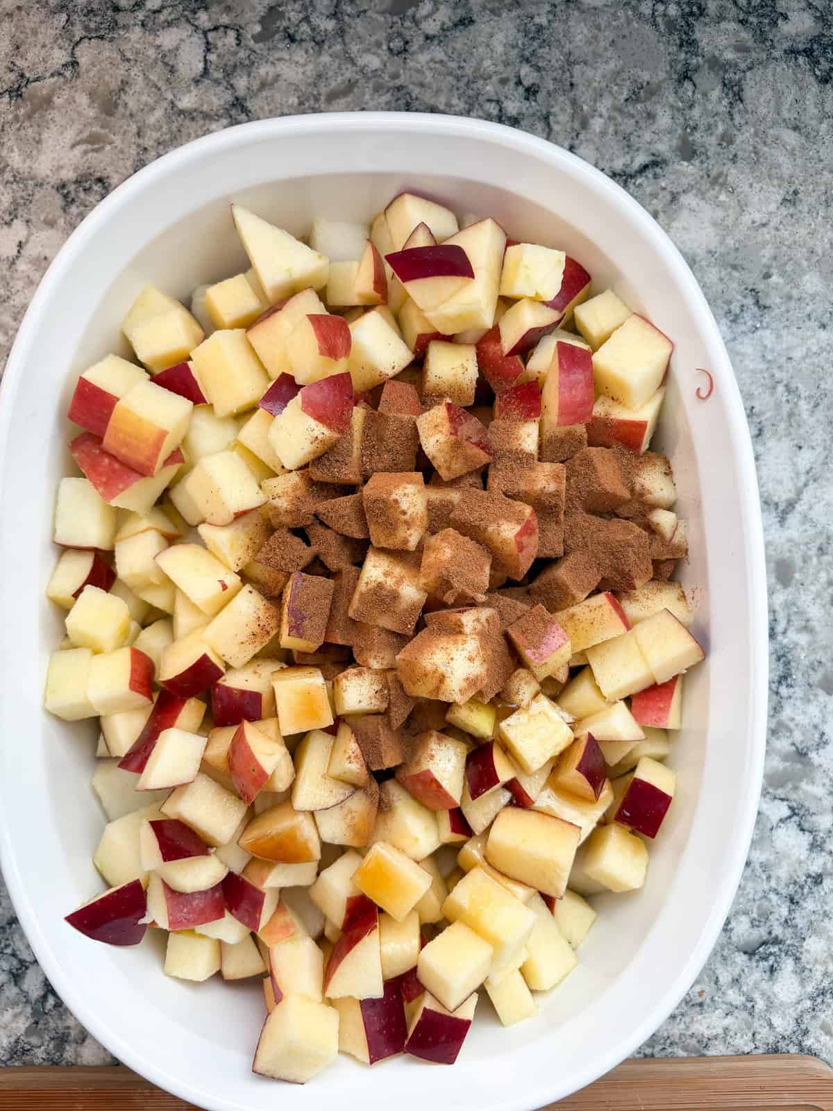 Spices added to chopped apples and pears.