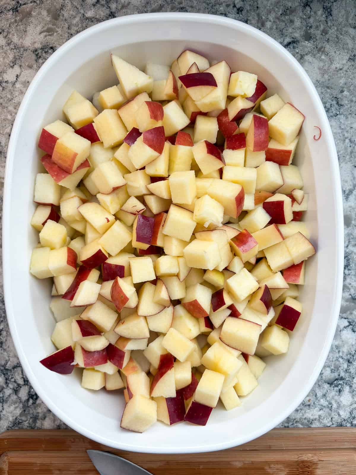 Chopped apples in a baking dish.