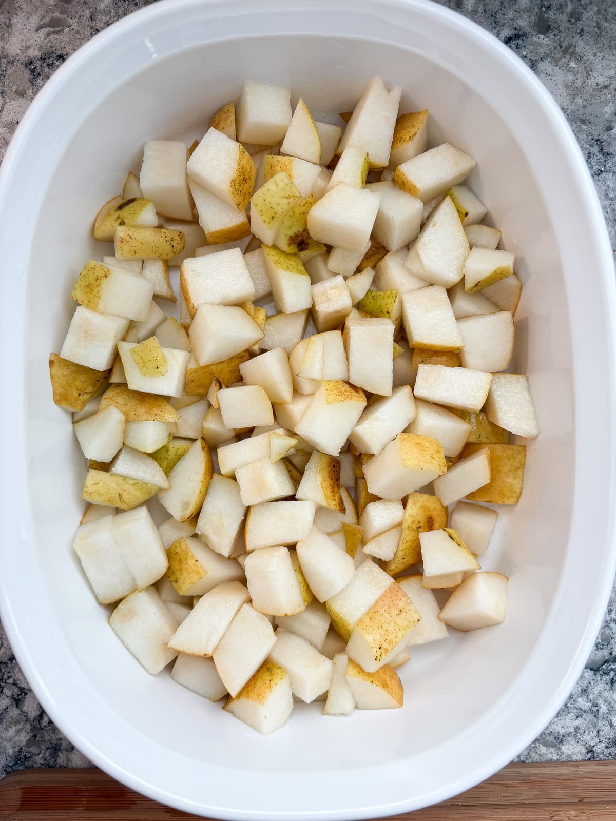 Chopped pears in a baking dish.