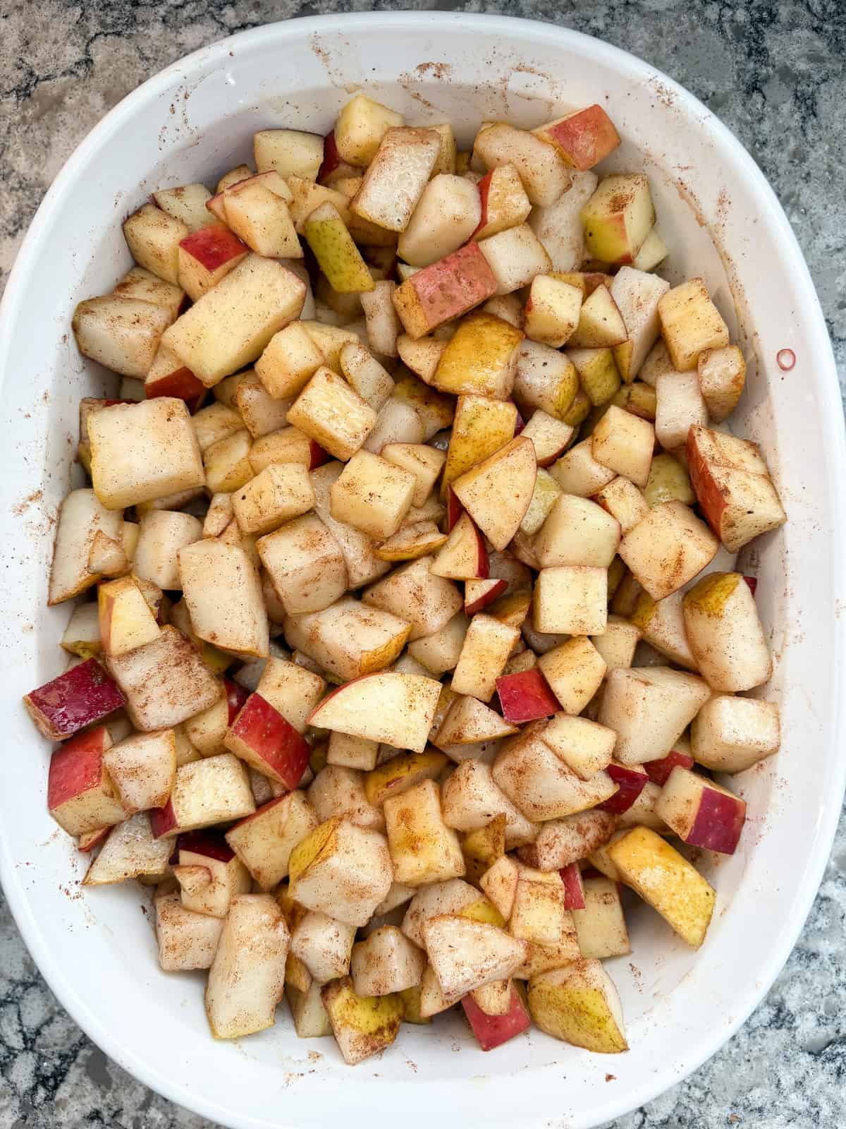 Apple pear filling mixed together, in a baking dish.
