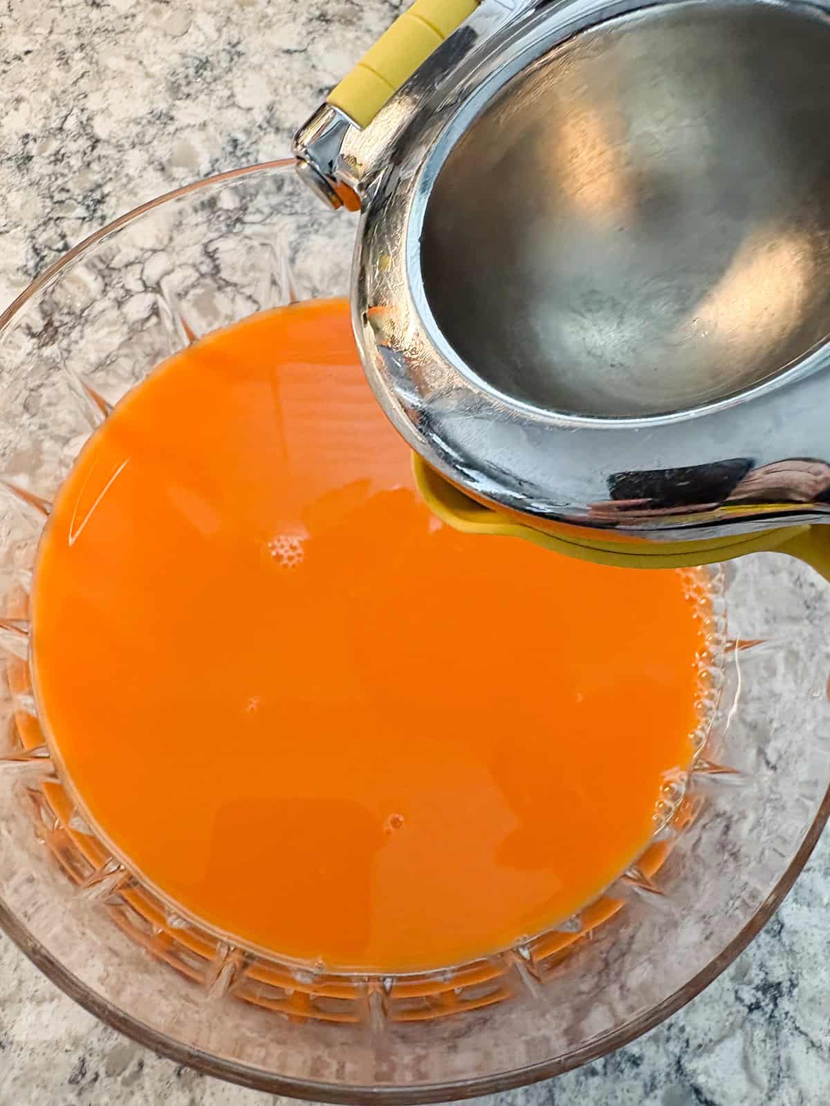 Lemon juice being added to the punch bowl.