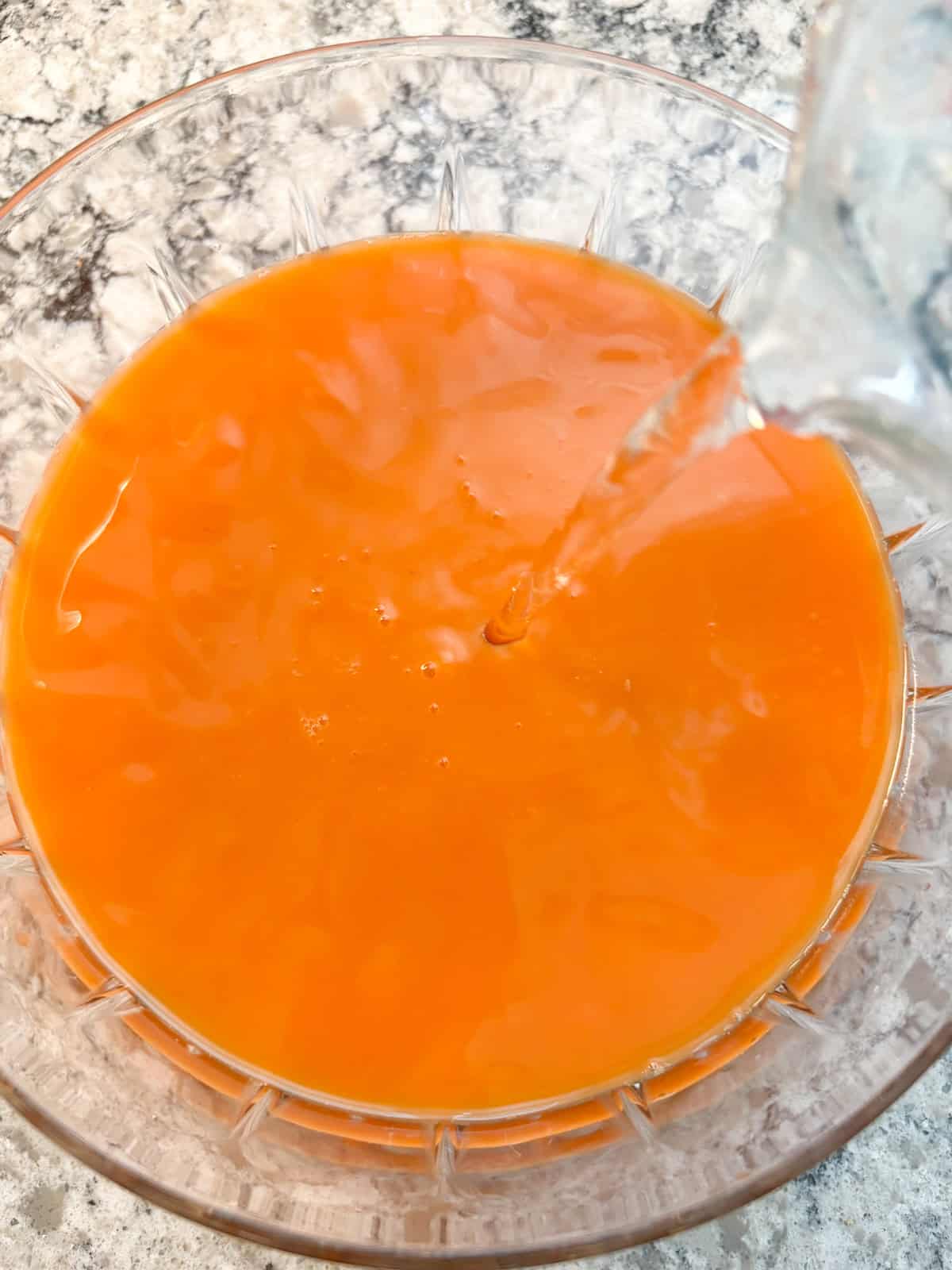 Seltzer water being poured into the punch bowl.