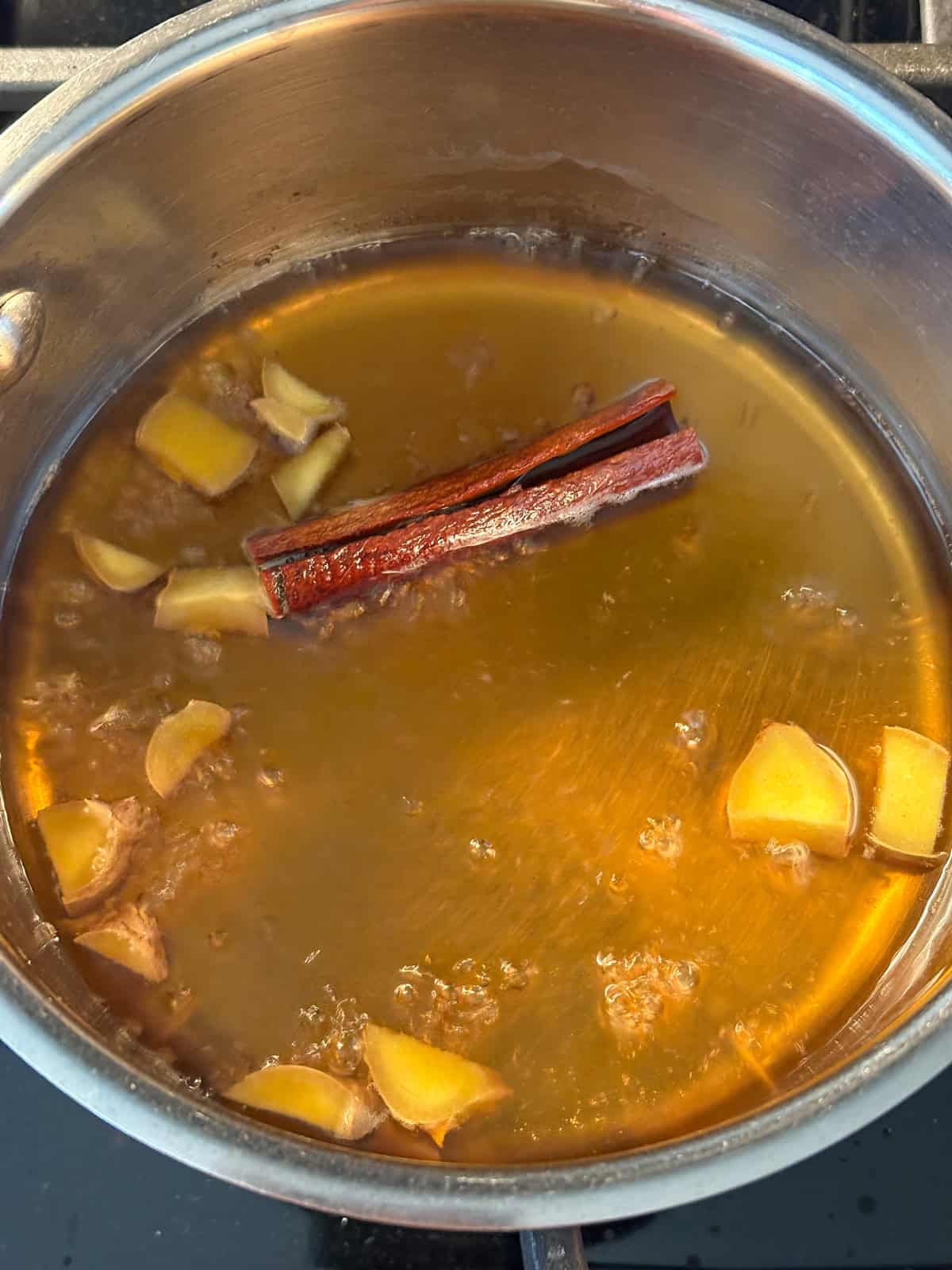 Simmering the ingredients for the spiced maple syrup.
