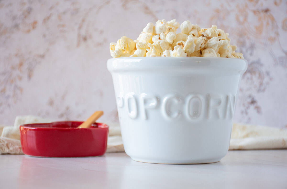 Ceramic bowl of popcorn.