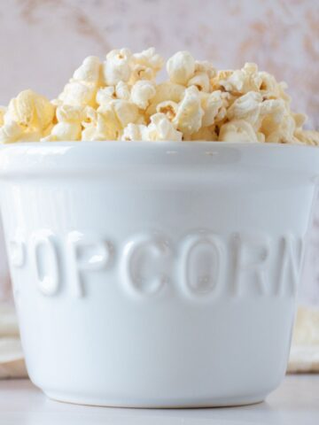 Ceramic bowl of popcorn.