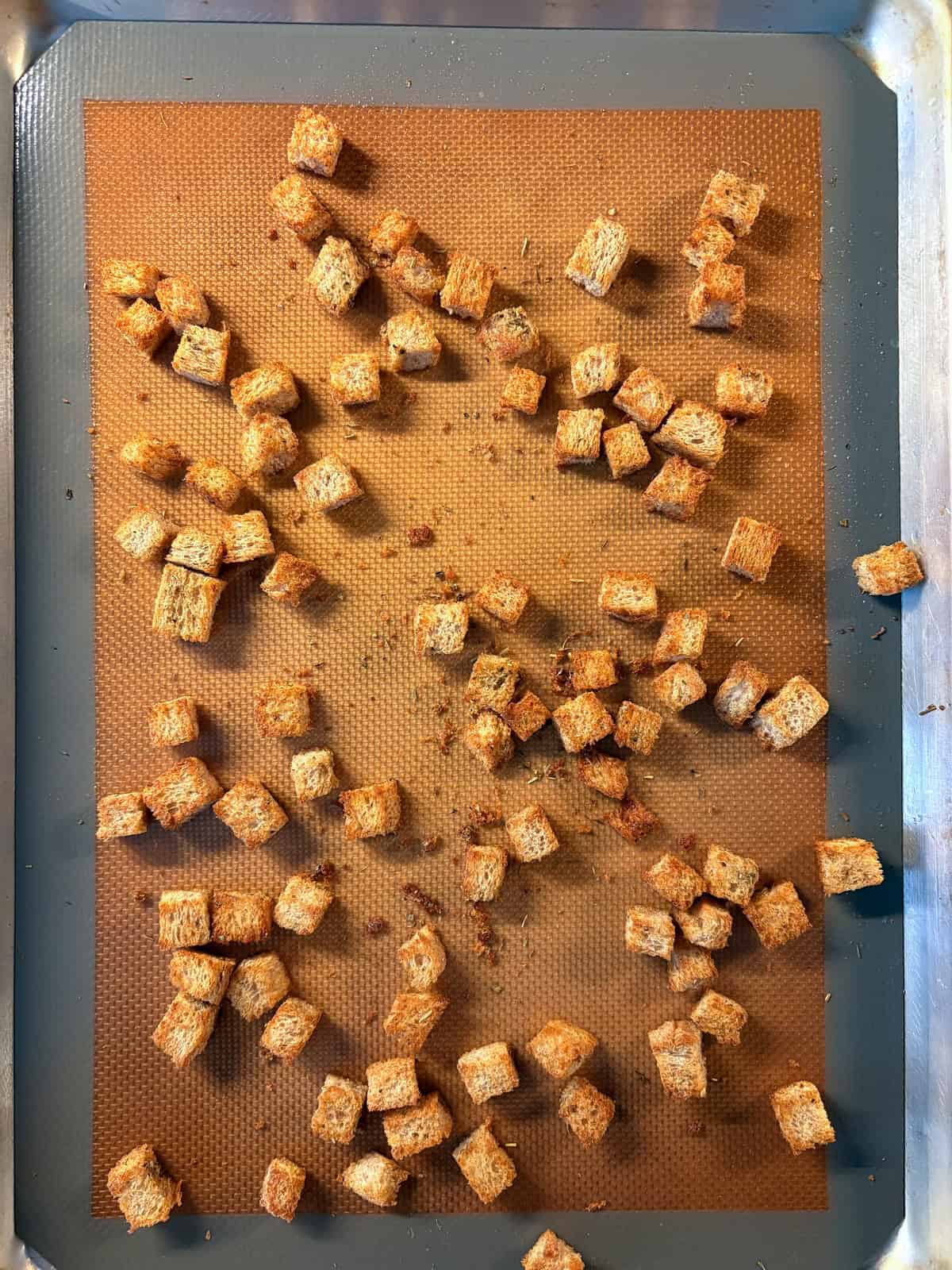 Baked croutons on a baking sheet.