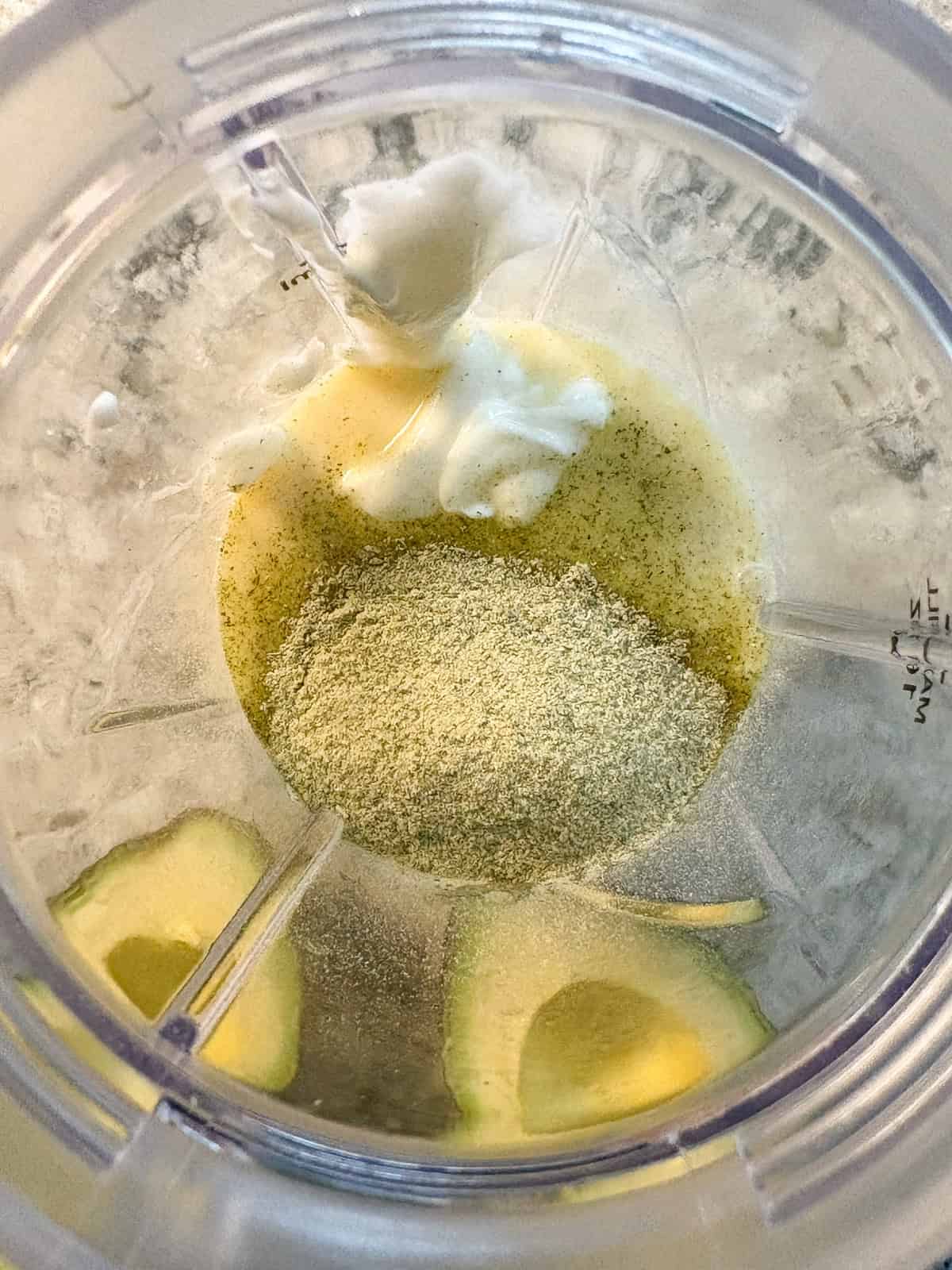 Blender with yogurt and ranch seasoning added to the milk.