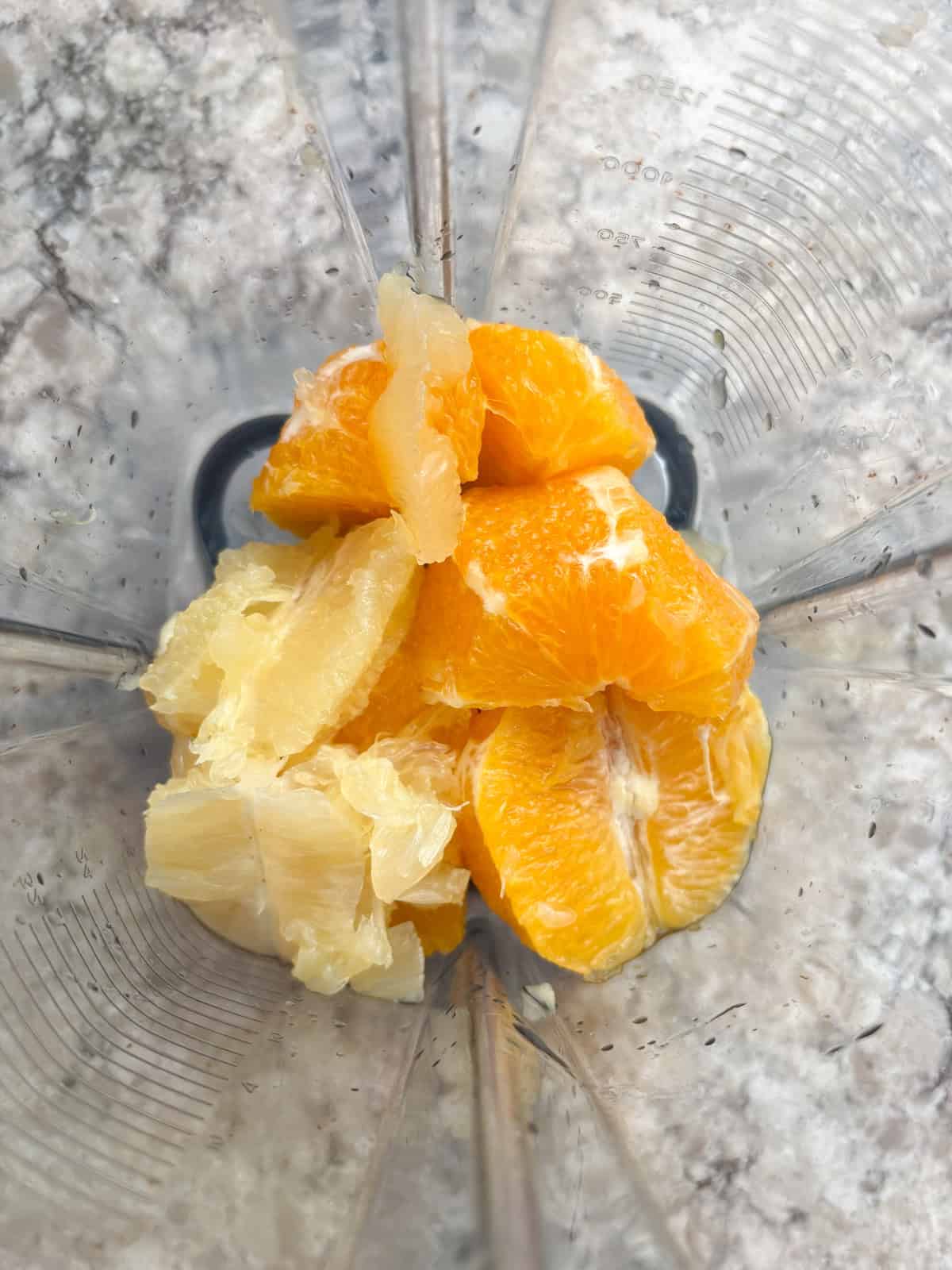 Oranges and lemon in a blender.