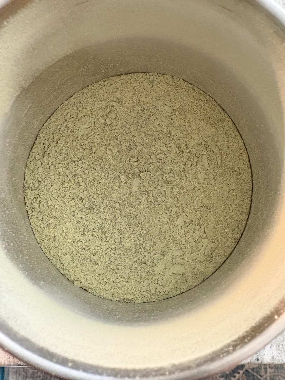 Ranch seasoning ingredients ground to a powder in a spice grinder.