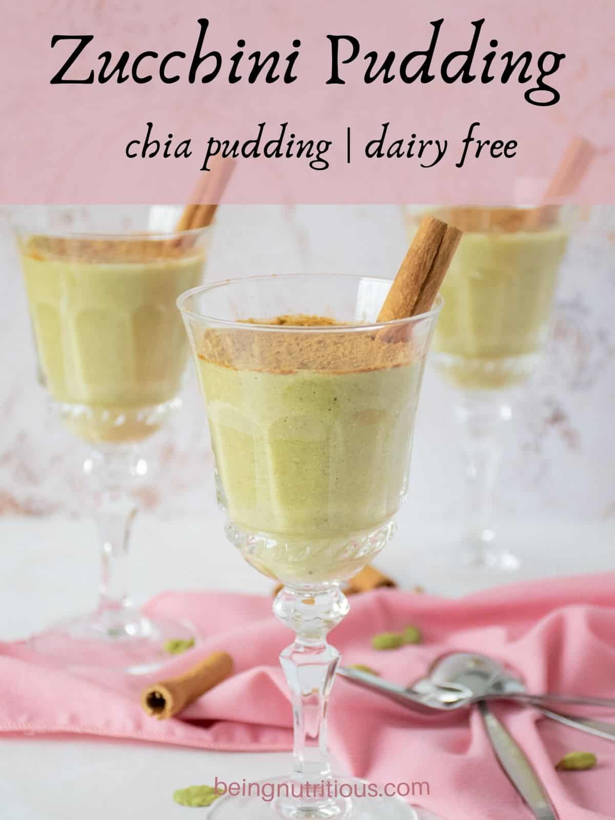 Three dessert glasses with green colored pudding in them, garnished with powdered cinnamon and a cinnamon stick. Text overlay: Zucchini Pudding; chia pudding; dairy free.