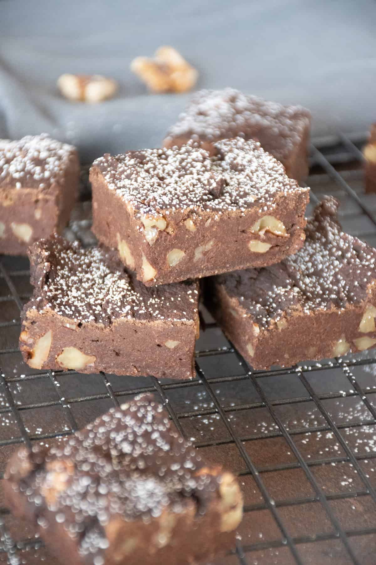 Cut brownies on a cooling rack, sprinkled with powdered sugar.