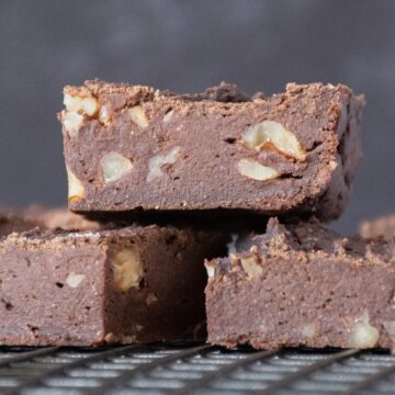 Side view of cut brownies on a cooling rack.
