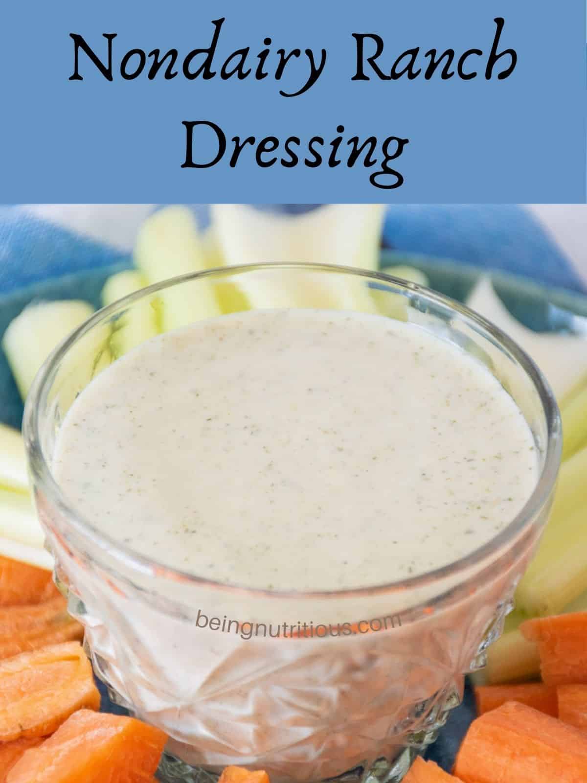 Small plate with carrot and celery sticks on it, and a small bowl of ranch dressing in the middle. Text overlay: Nondairy Ranch Dressing.