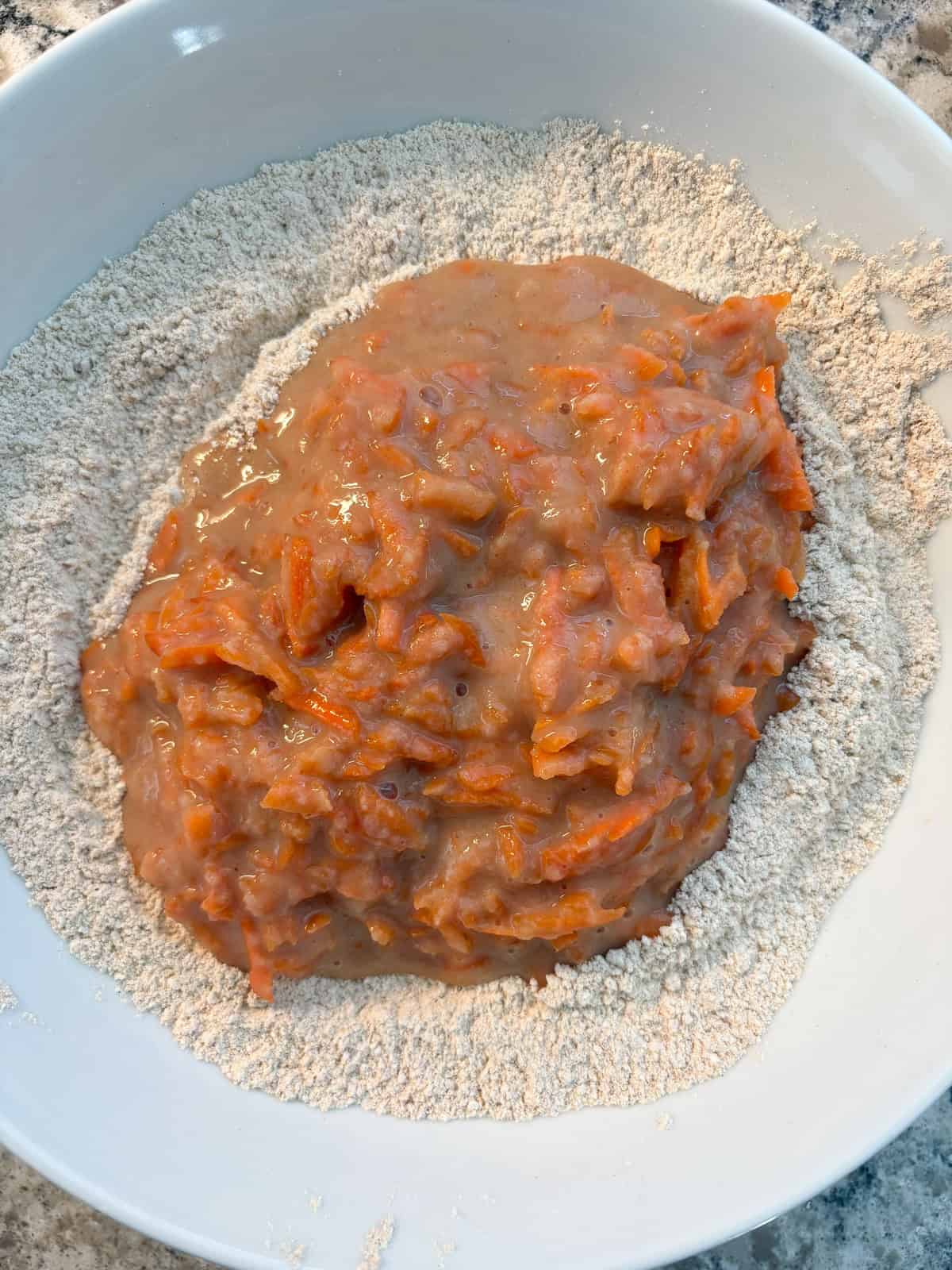 Wet ingredient mixture poured into dry ingredient mixture.