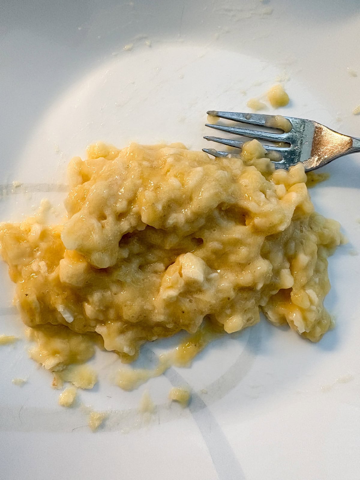Mashed banana on a plate.