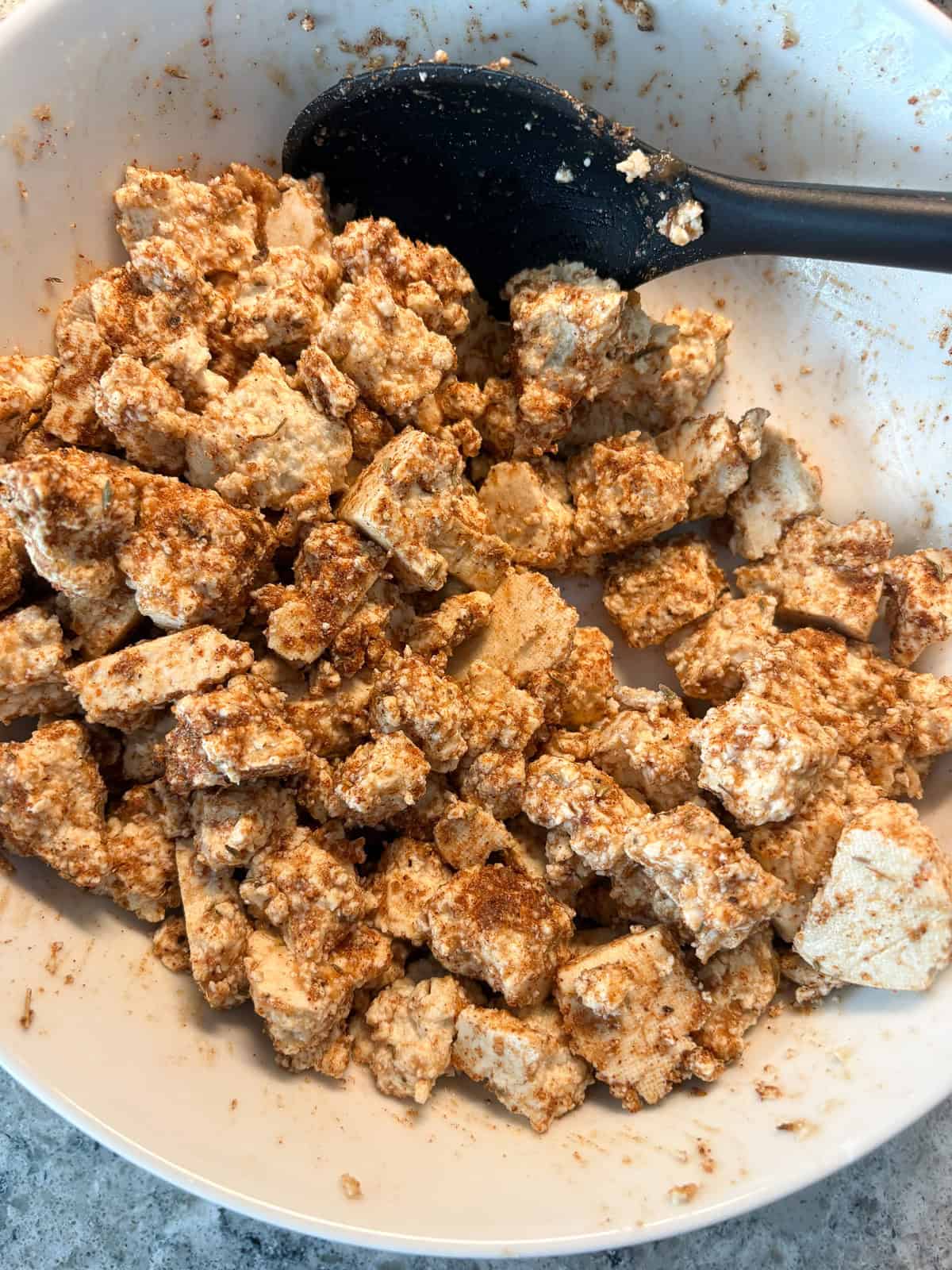 Torn tofu pieces mixed with date paste and spices.