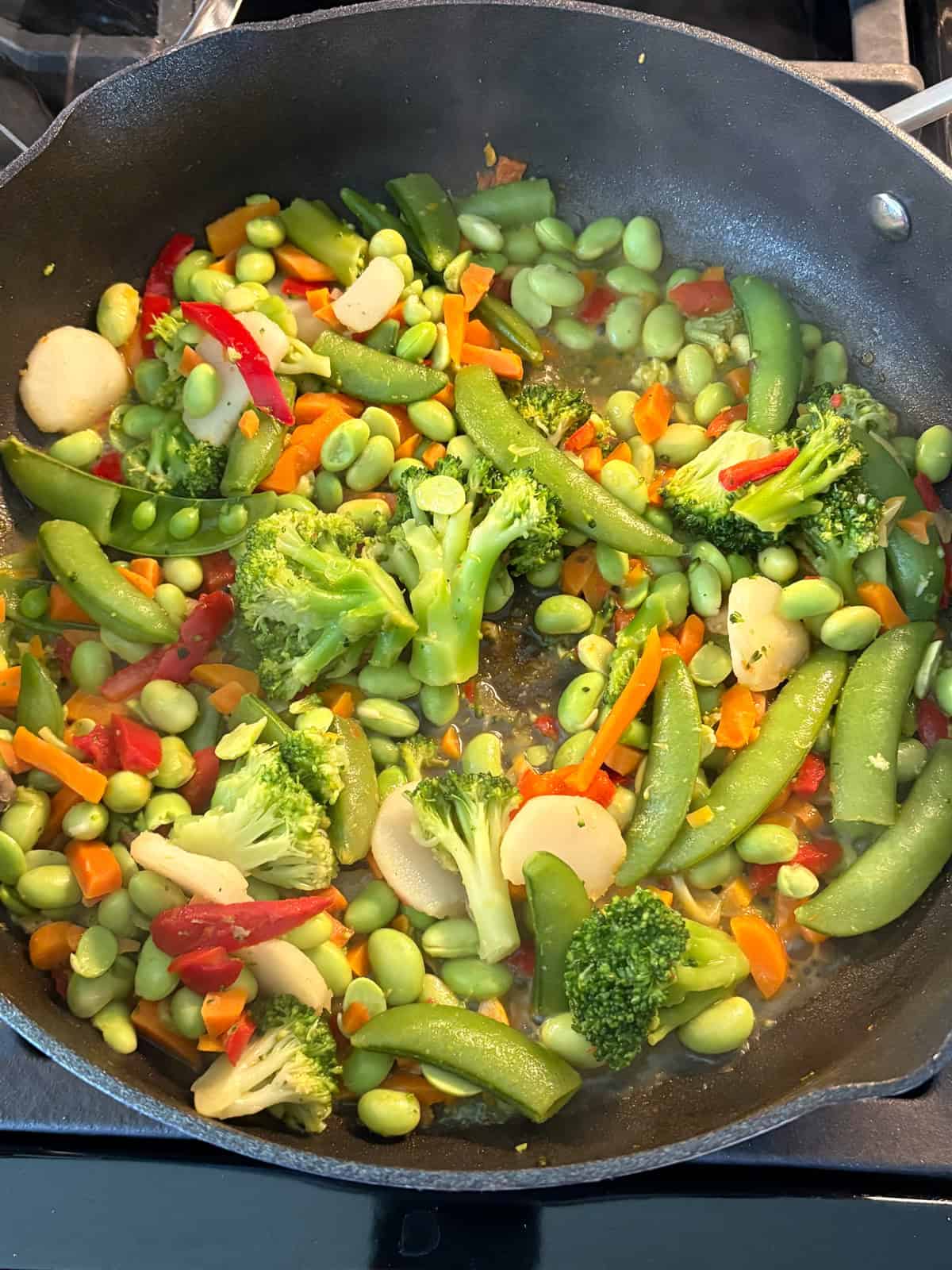 Sauteed vegetables in a skillet.