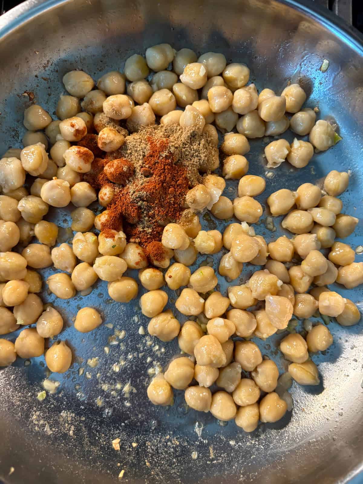 Spiced added to sauteing chickpeas.
