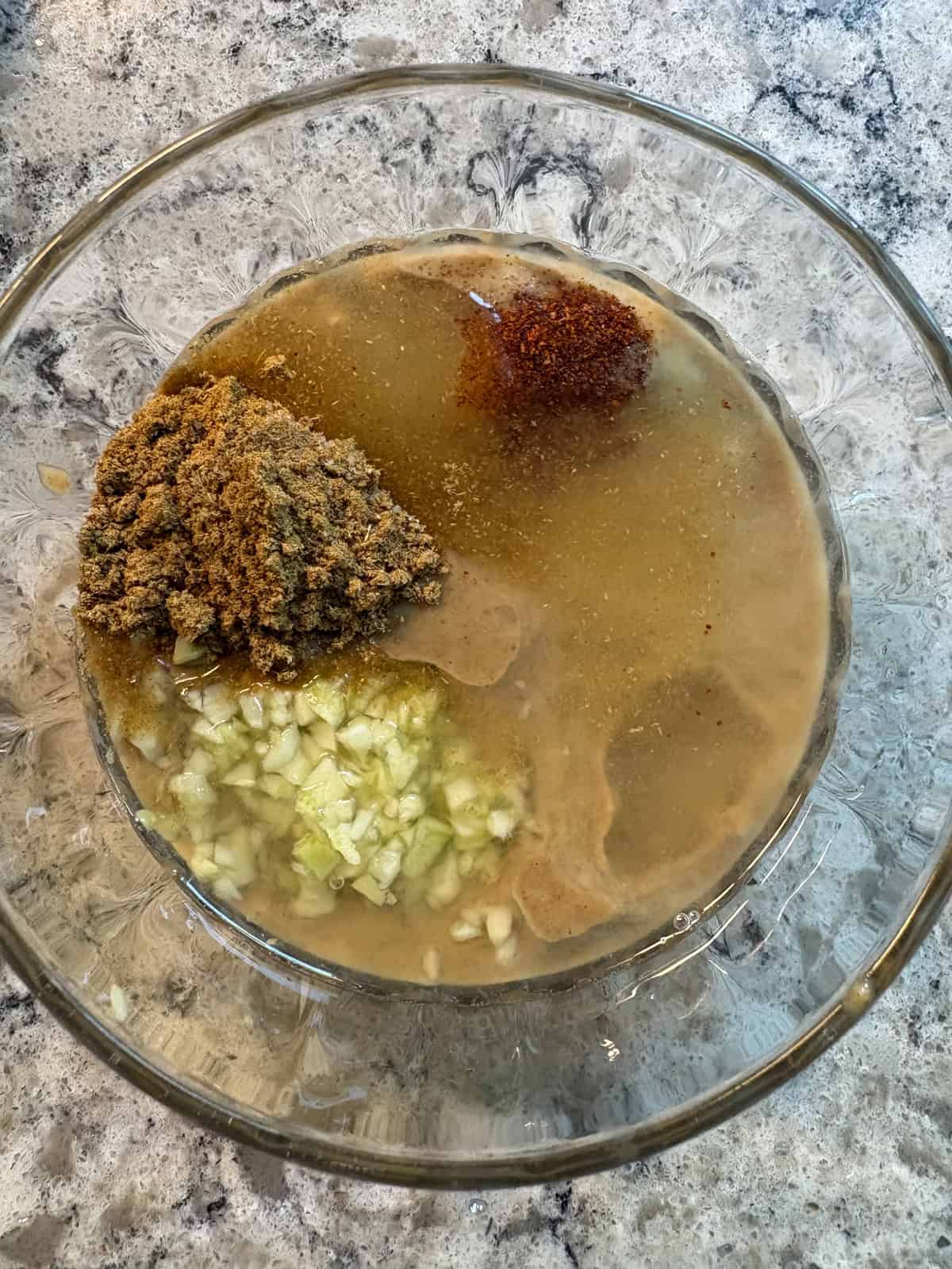 Tahini dressing ingredients, all measured into a bowl, unmixed.