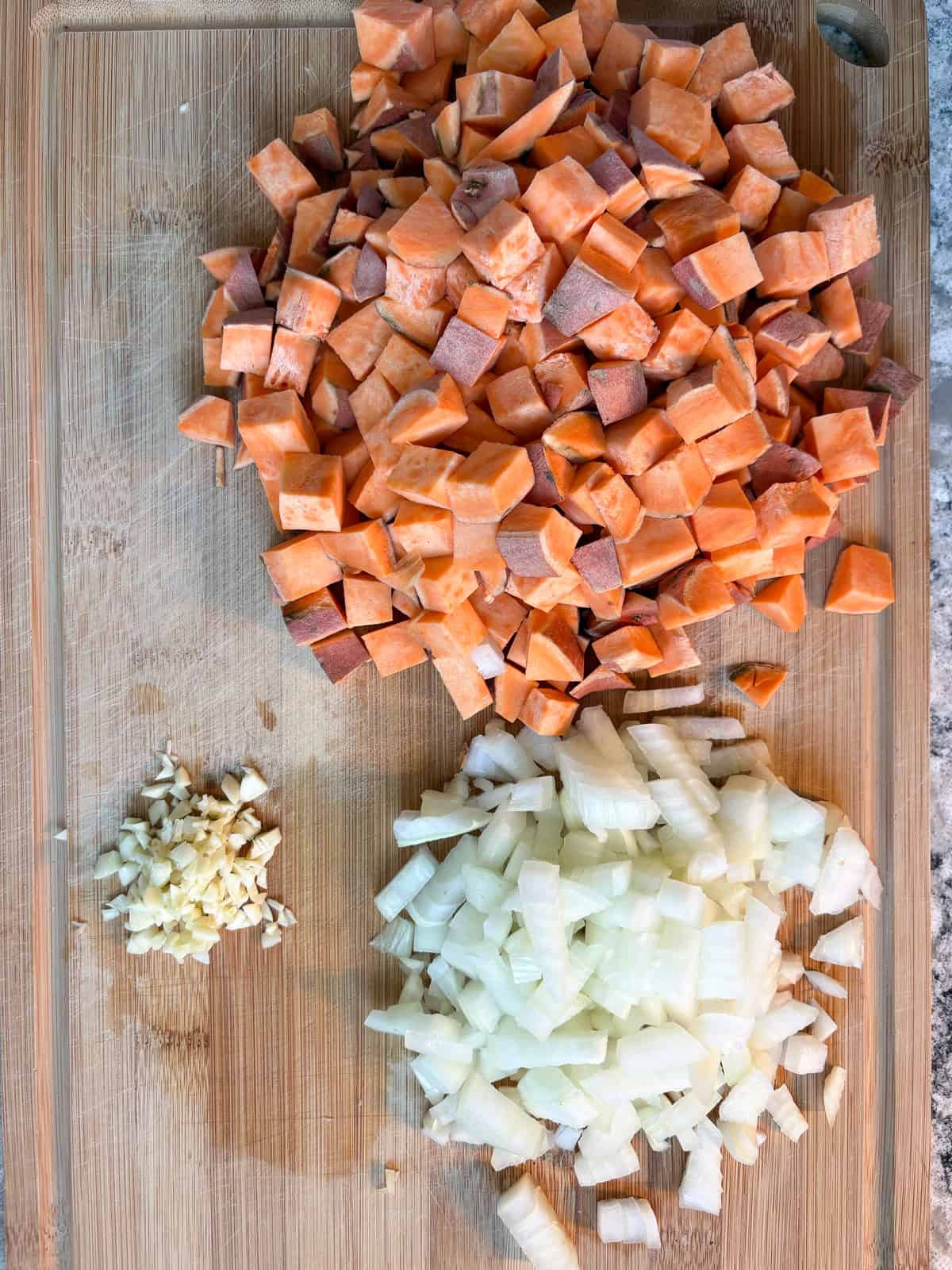 Chopped veggies on a cutting board.